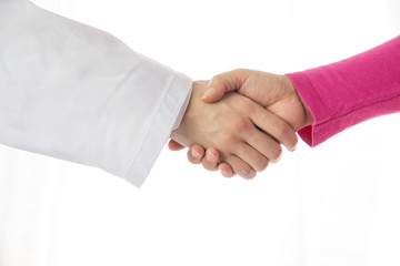 Doctor and patient shaking hands