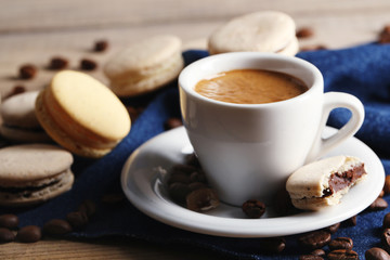 Gentle colorful macaroons and  coffee in mug