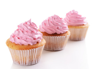 Delicious cupcakes isolated on white