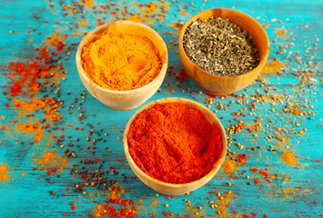 Different seasoning in wooden bowls