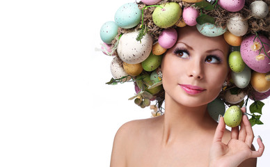 Easter Woman. Portrait of Beautiful Model with Colorful Eggs.