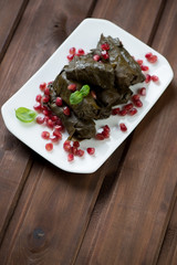 Dolma or grape leaves stuffed with rice and meat, studio shot