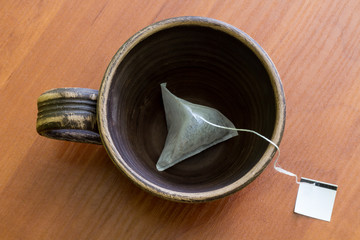 Сlay cup with teabag.  Top view.