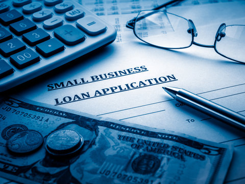 small business loan application on the desk.