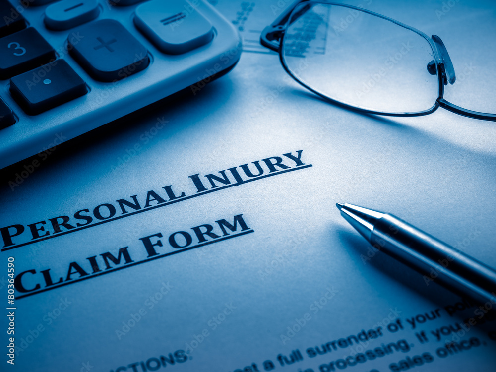 Wall mural personal injury claim form on desk.