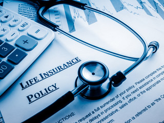 life insurance policy on the desk.