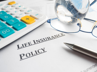 life insurance policy on the desk.