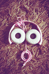 Vintage of ear phone on carpet look like human eye with the sun