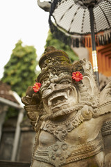 balinese god in front of hindu temple
