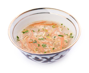 Bowl of chicken soup with vegetables and noodles