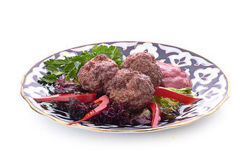 Meat on a grill with vegetables