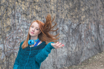 Beautiful girl posing in an urban context