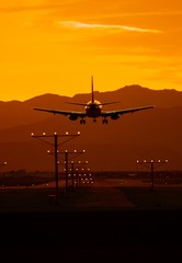 Fototapeta na wymiar Airplane Travel at Sunset