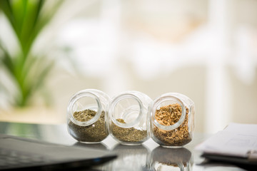 Herbal medicine - jars of herbs on the table. Homeopathy 