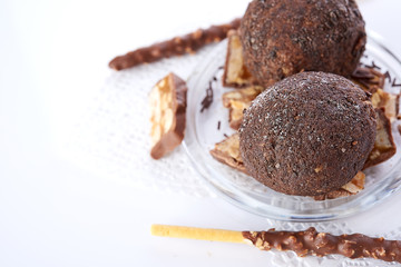 Cupcake with chocolate on wooden background