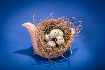 Naklejka na ściany i meble Souvenir bird with nes and eggs