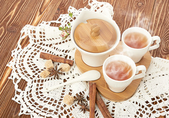 tea with sugar cubes on wooden