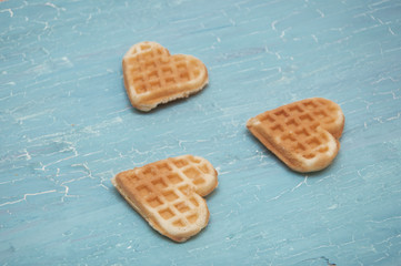 three waffles on a blue background