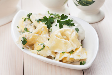 Tortellini pasta in cheese sauce