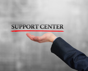 Businessman showing support center sign. Business, technology