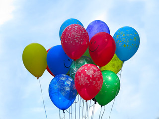 Flying colorfull balloons over blue sky