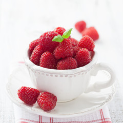 Cup of juicy raspberries