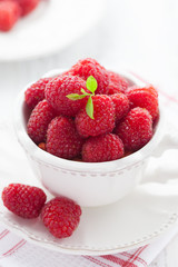 Cup of juicy raspberries