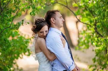 Fototapeta premium Wed couple standing in park