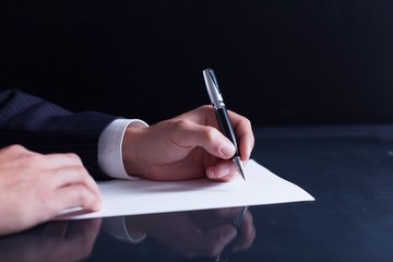 Lawyer. Businessman writing a letter, notes or correspondence or