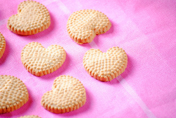 Heart shaped cookies on pink cloth