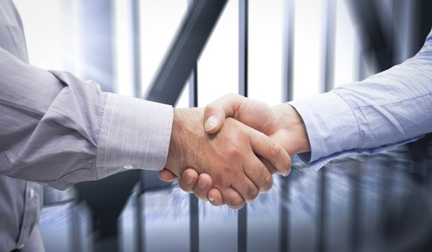Composite image of men shaking hands