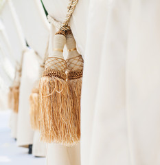 Tassels on a chair, wedding decorations