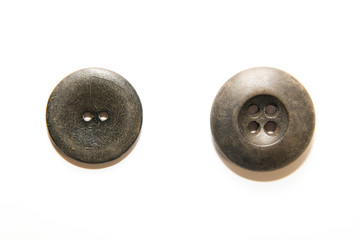Two big vintage buttons on  white background