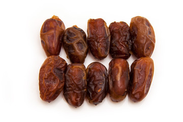 Medjool dates isolated on a white background.