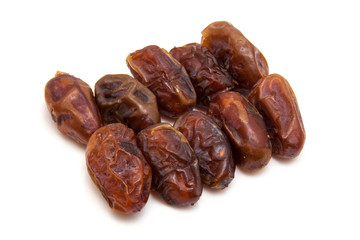 Medjool dates isolated on a white background.