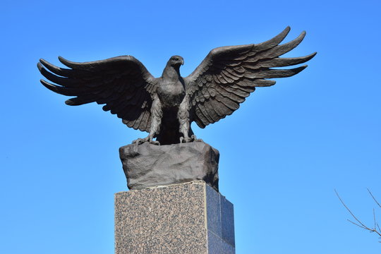Sculpture featuring an eagle with spread wings
