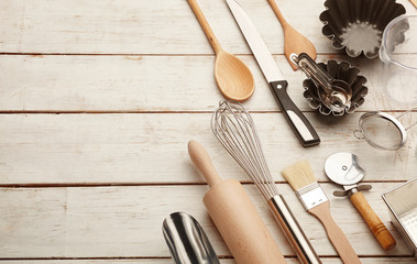 Kitchen baking utensils against white desk
