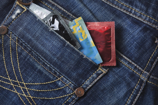 variety of Condoms in the blue jeans pocket - Powered by Adobe