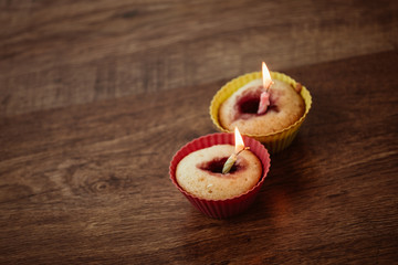 Birthday Banana muffin on wooden background