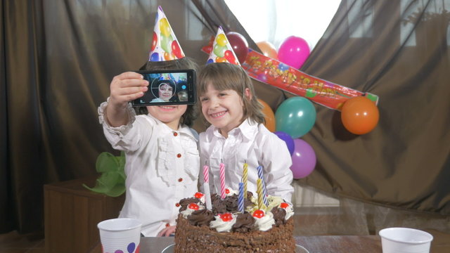 Girls taking a selfie at a birthday party 
