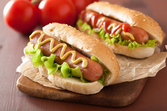 hot dog with ketchup mustard and lettuce