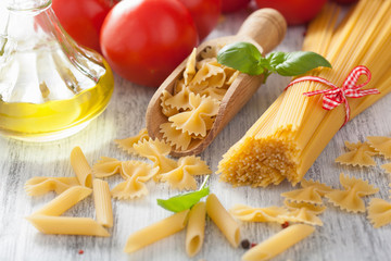 raw pasta olive oil tomatoes. italian cuisine