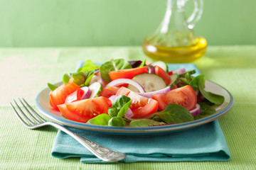 healthy tomato salad with onion cucumber pepper