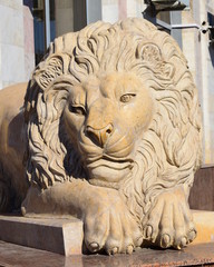 Sculpture featuring a lying lion