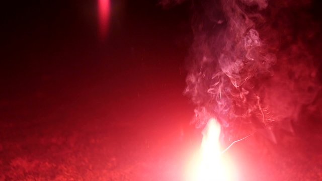 Red bengal fire with strobo effect on black