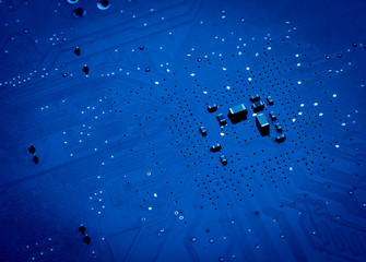 blue circuit board background of computer motherboard