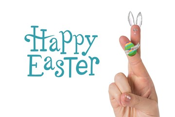 Composite image of fingers as easter bunny