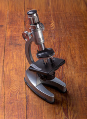 Microscope on table for vintage science background