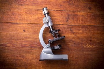 Microscope on table for vintage science background