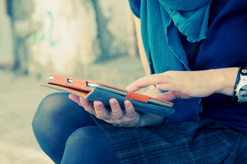 close up woman's hands with tablet